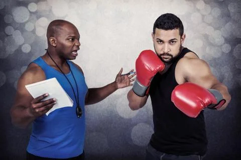 Composite image of boxing coach with his fighter Stock Photos