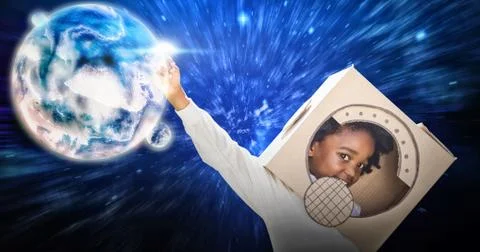 Composite image of boy playing as an astronaut in a park Stock Photos