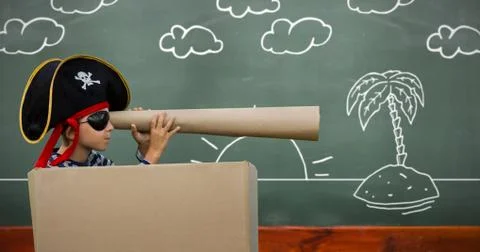 Composite image of boy pretending to be a pirate Stock Photos