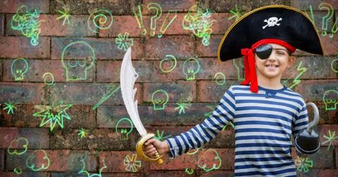 Composite image of boy pretending to be a pirate Stock Photos