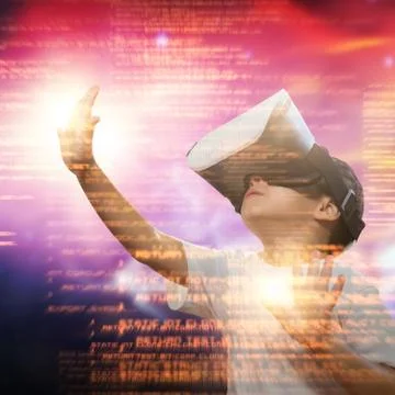 Composite image of boy using virtual reality simulator glasses Foto stock