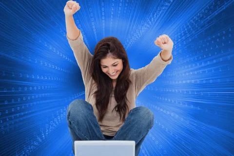 Composite image of brunette cheering while using laptop Illustrazione stock