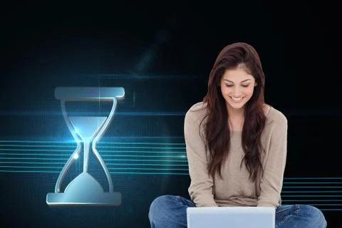 Composite image of brunette sitting on floor using laptop Illustrazione stock