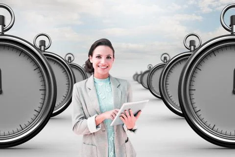 Composite image of brunette using tablet pc Stock Illustration