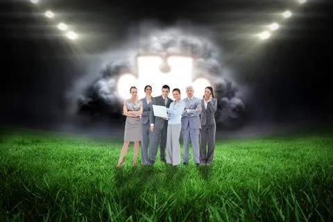 Composite image of business team looking at camera Stock Illustration