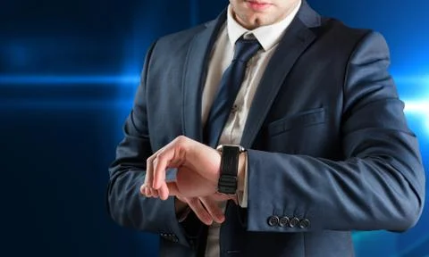Composite image of businessman checking the time on watch Stock Illustration