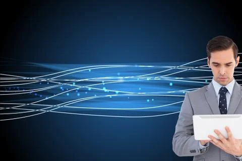 Composite image of businessman holding a tablet computer Illustrazione stock