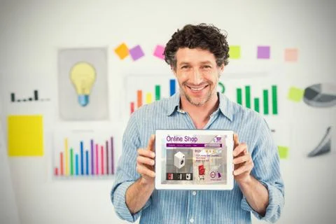 Composite image of businessman showing digital tablet with blank screen in Stock Photos