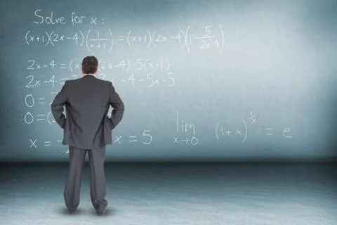 Composite image of businessman standing back to the camera with hands on hip Foto stock
