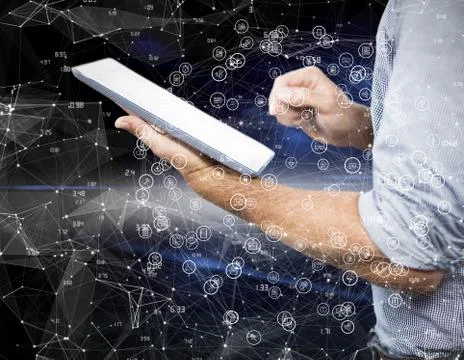 Composite image of businessman using digital tablet over white background Stock Photos