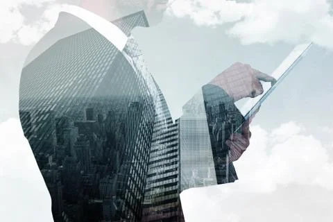 Composite image of businessman using his tablet pc Illustrazione stock