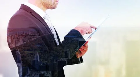 Composite image of businessman using his tablet pc 스톡 일러스트