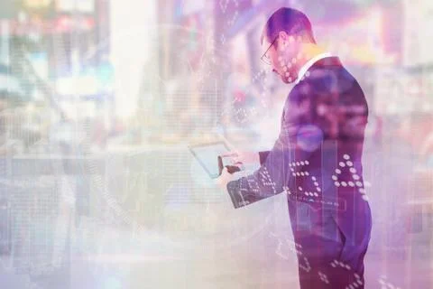 Composite image of businessman using his tablet pc Illustrazione stock