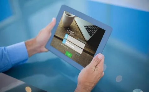 Composite image of businessman using his tablet Stock Photos