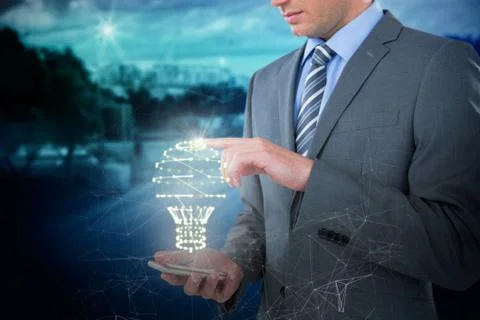 Composite image of businessman using mobile phone Stock Photos
