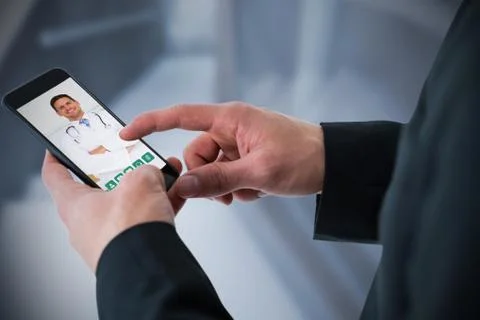 Composite image of businessman using smart phone Stock Photos