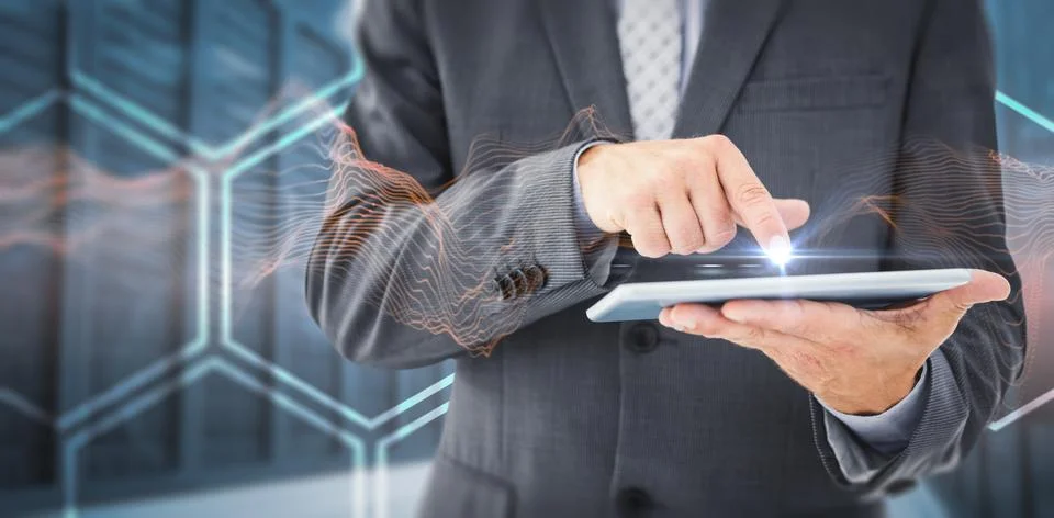 Composite image of businessman using tablet pc 스톡 사진