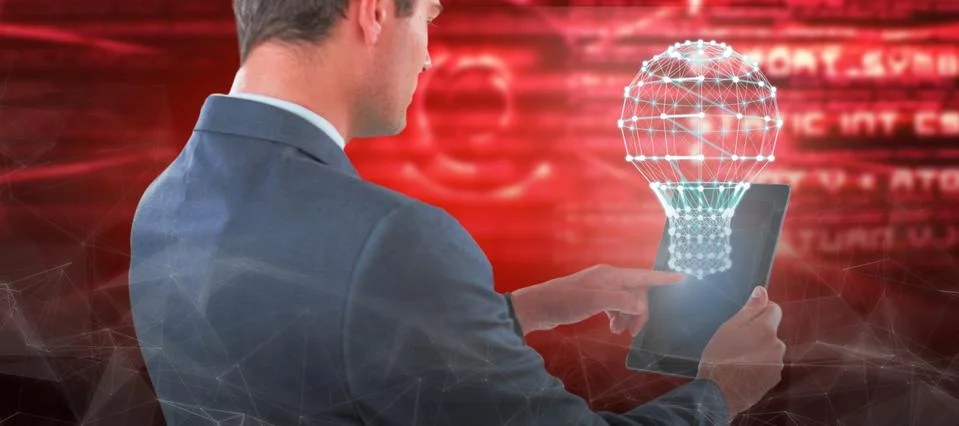 Composite image of businessman using tablet Stock Photos