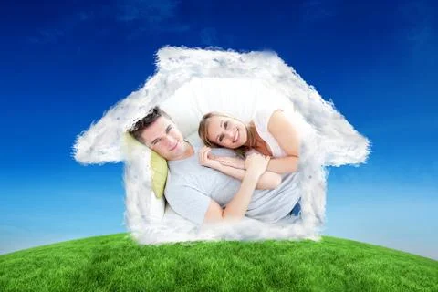 Composite image of caress young couple lying together on the sofa in the Stock Illustration