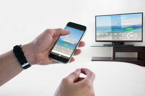 Composite image of close-up of man holding mobile phone Stock Photos