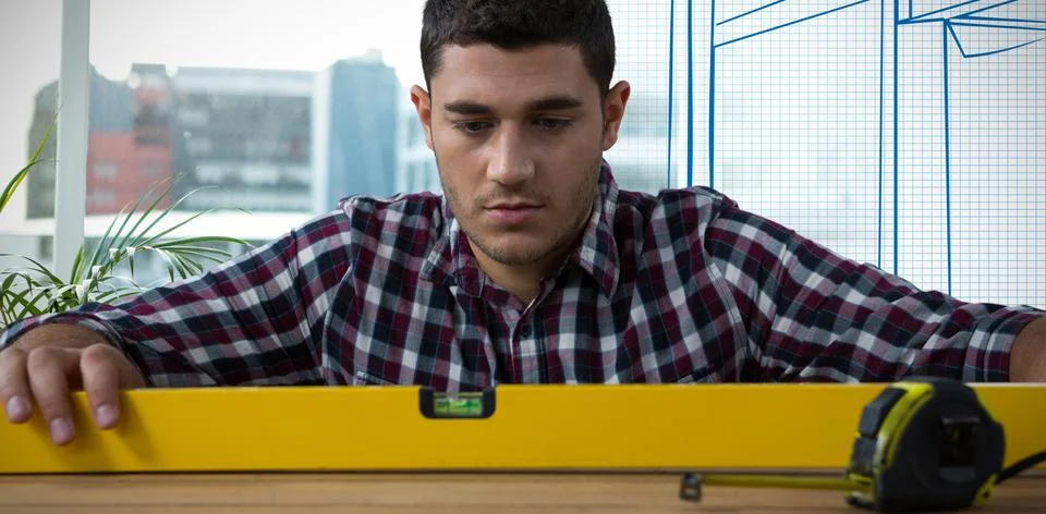 Composite image of close-up of serious construction worker Foto stock