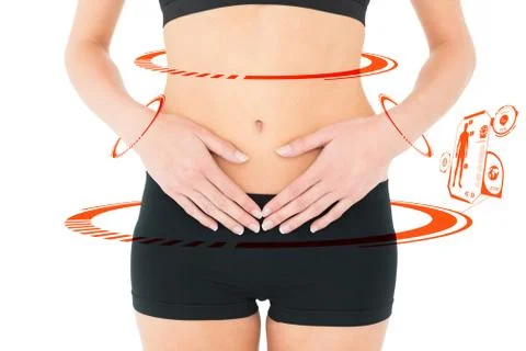 Composite image of closeup mid section of a fit woman with stomach pain Illustrazione stock