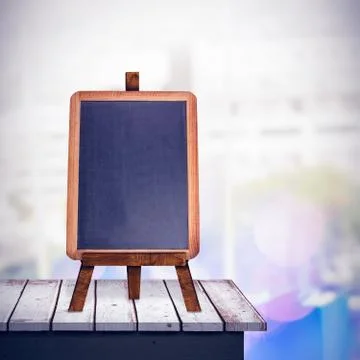 Composite image of computer and colour chart on desk in office Ilustración de archivo
