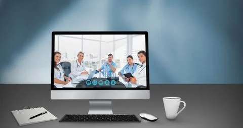 Composite image of computer by book and cup Stock Photos