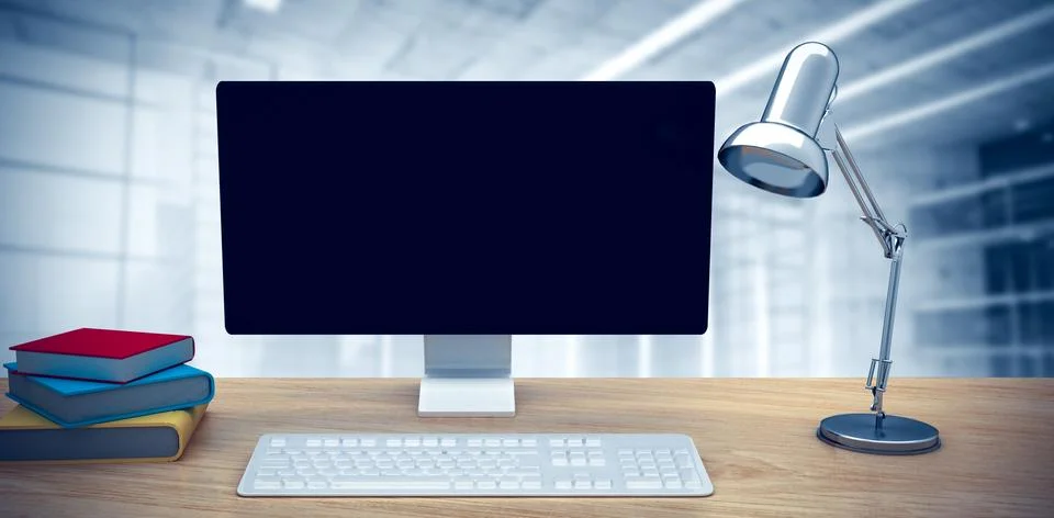 Composite image of a computer over a desk Illustrazione stock