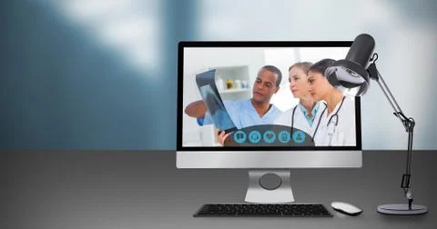 Composite image of computer by table lamp Stock Photos