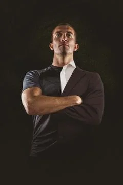 Composite image of confident rugby player with arms crossed Stock Photos