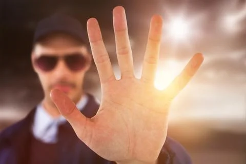 Composite image of confident security officer making stop gesture Foto stock