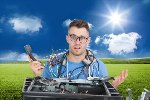 Composite image of confused it professional with cables and phone in front of Illustrazione stock