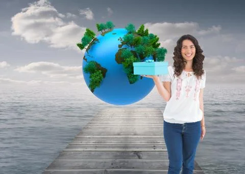 Composite image of content casual brunette holding a present Stock Illustration