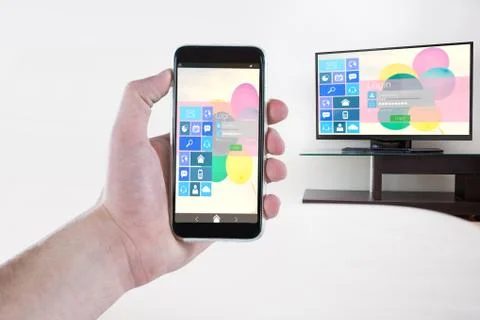 Composite image of cropped hand holding mobile phone Stock Photos