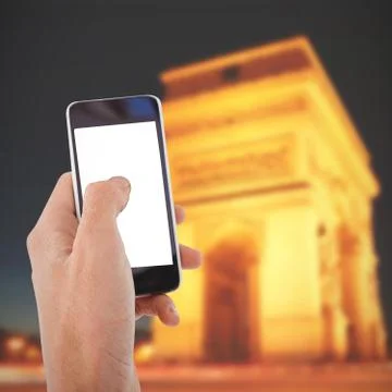 Composite image of cropped hand of man using mobile phone Stock Photos