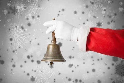Composite image of cropped image of santa claus holding handle bell Photos