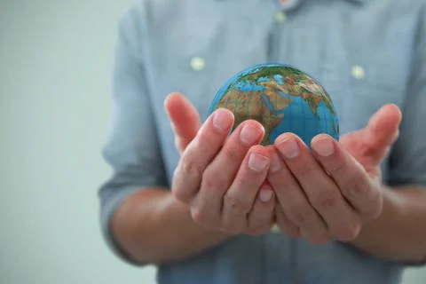 Composite image of cupped hands of man holding invisible object Stock Photos