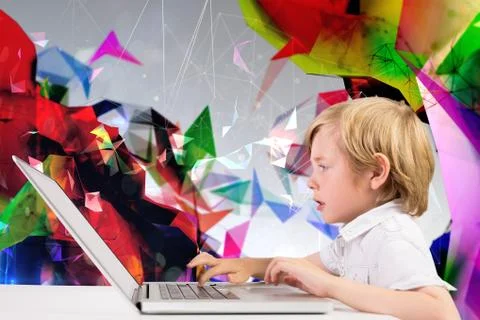 Composite image of cute boy using laptop Stock Photos