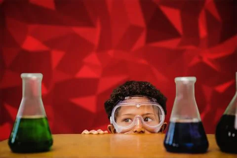 Composite image of cute pupil dressed up as scientist Foto stock