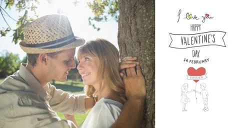 Composite image of cute smiling couple leaning against tree in the park Ilustración de archivo