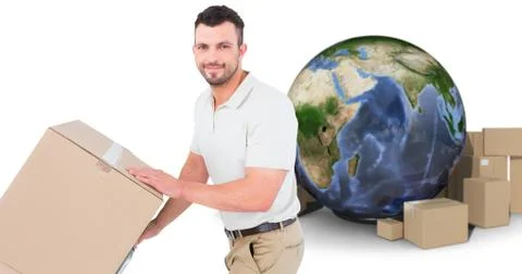 Composite image of delivery man pushing trolley of boxes 写真素材