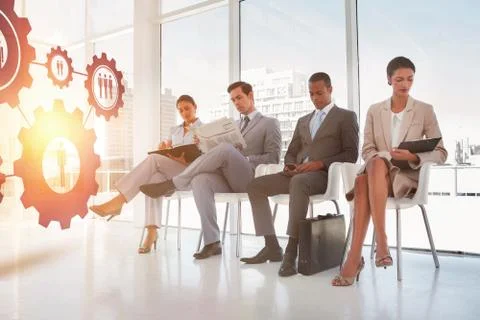 Composite image of digital image of human representations in gears Foto stock