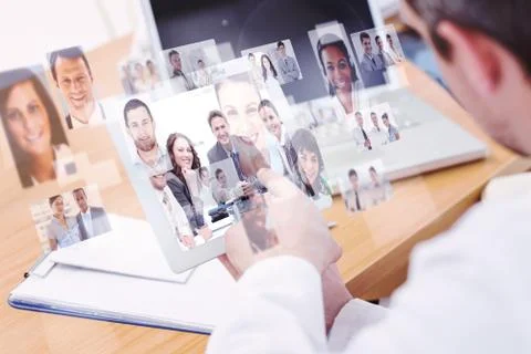 Composite image of doctors using laptop and digital tablet in meeting Stock Illustration