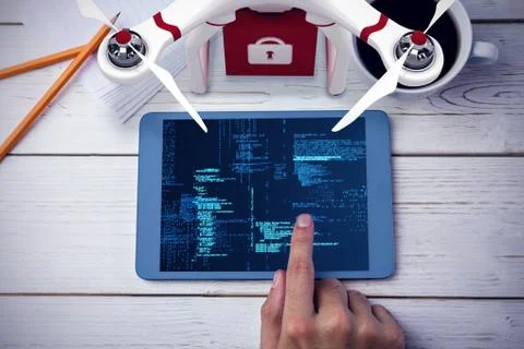 Composite image of a drone bringing a red cube Illustrazione stock