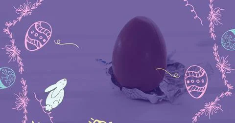 Composite image of easter decorative pattern over close up of a easter egg Foto stock