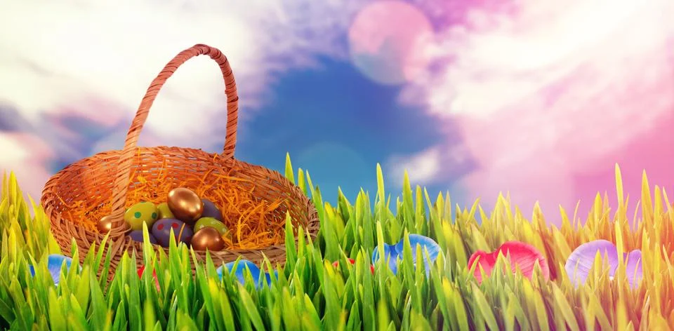 Composite image of easter eggs in paper nest basket Stock-Fotos