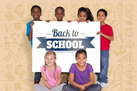 Composite image of elementary pupils showing card 写真素材