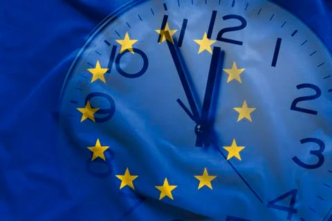 Composite image of EU flag and clock Stock Photos