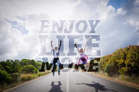 Composite image of excited couple jumping on the road Ilustração Stock